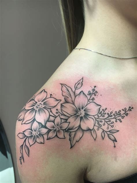 floral shoulder tattoo|flower shoulder tattoos for females.